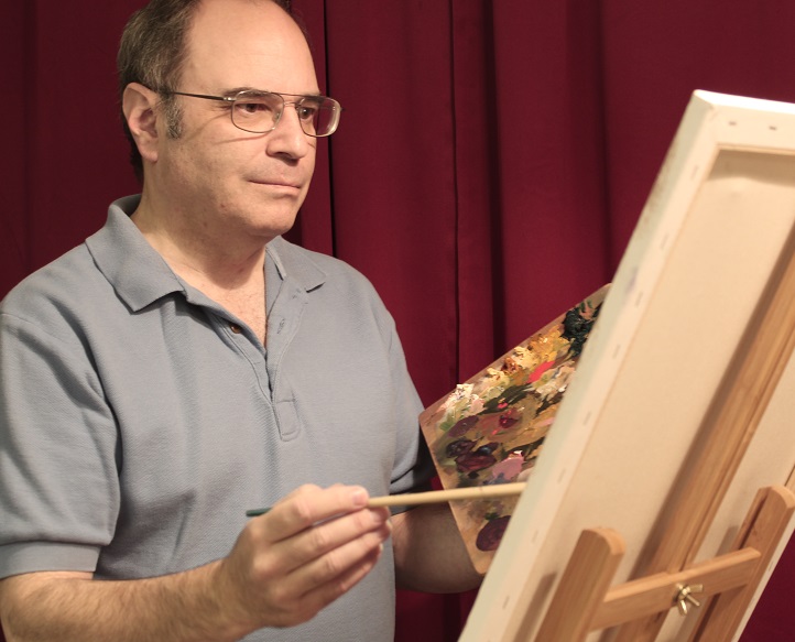 photo of artist at an easel
